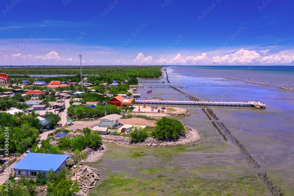 Rainbow bridge in Thailand.View of The colorful wood bridge extends into the sea at samut sakhon province,Thailand,Aerial view.
