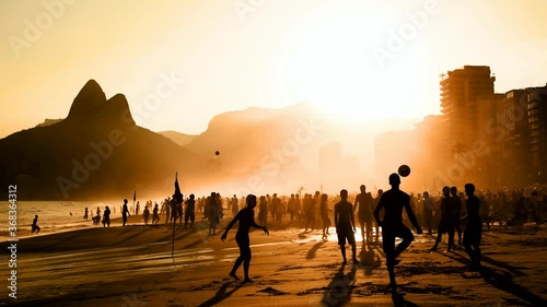 Silhouettes of Young Brazilians Playing Football in the Beach in Rio de Janeiro