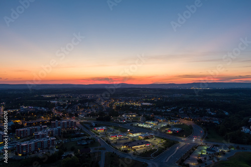 Aerial view of Urbana, Frederick County, Maryland at dusk. Catoctin Mountain, part of the Blue Ridge Mountains, is on the horizon.
