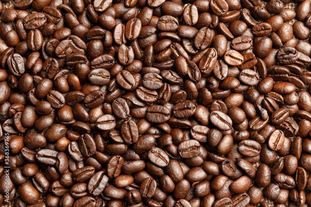 Fototapeta premium Delicious roasted coffee beans, smooth and fragrant, Coffee beans background.