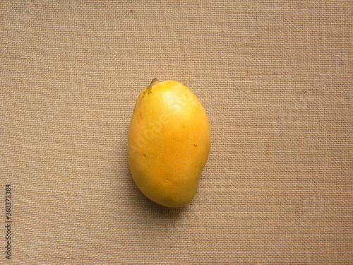 Yellow color whole ripe fresh Mallika mango photo