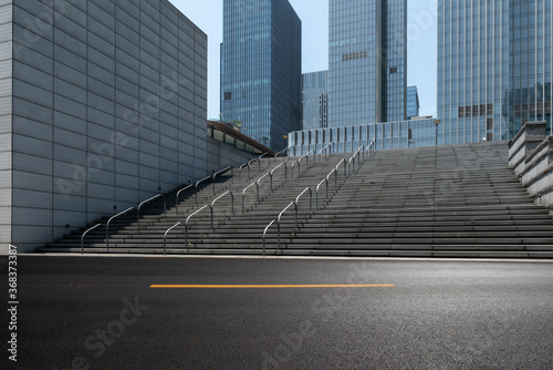 empty asphalt road in front of modern office buildings. photo