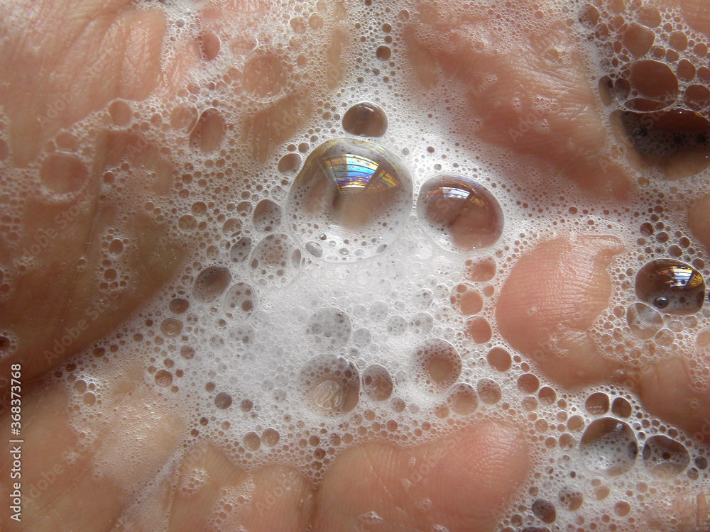 Soap froth on palm of hand
