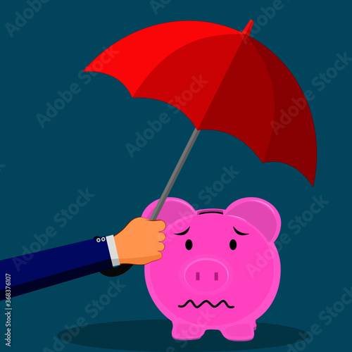 Handle the umbrella to protect the piggy bank. financial savings concept