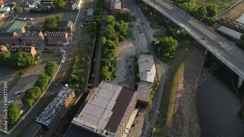 Drone shot over warehouse and city 24fps photo