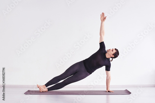 Man practice yoga. Pilates training at home. Dancer workout. Online teacher. Balance asana