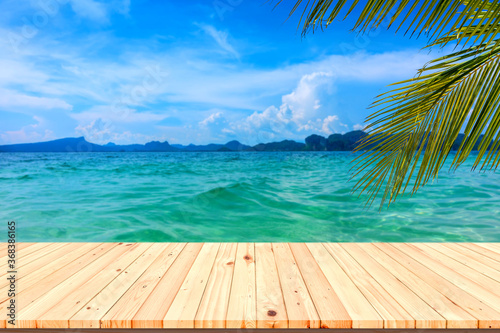 Fototapeta Naklejka Na Ścianę i Meble -  Wooden floor or plank on sea in summer. For product display.Calm Sea and Blue Sky Background.
