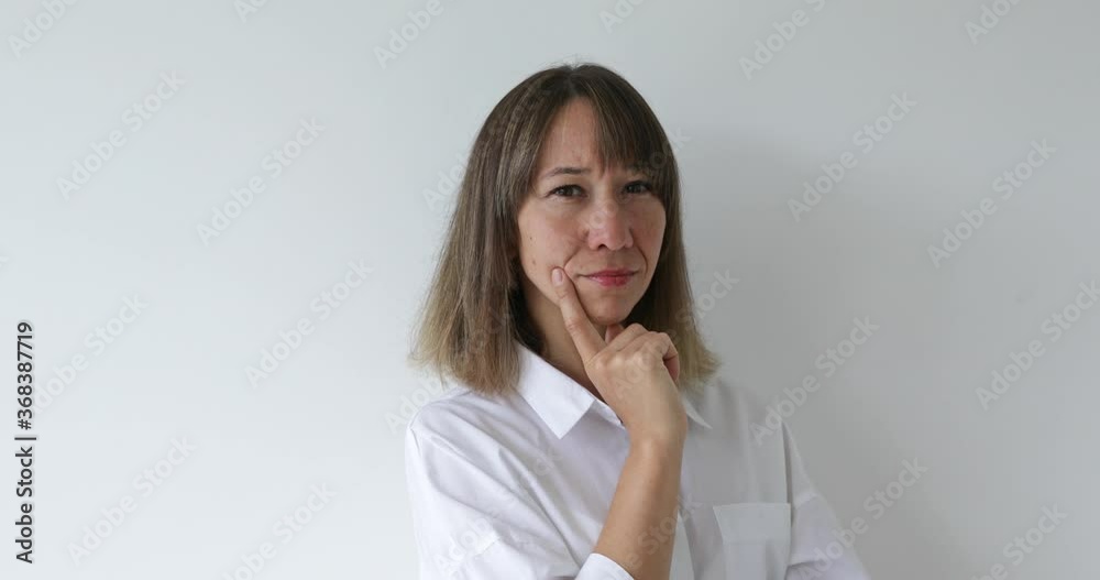 Portrait of young woman looking at camera with happy emotion enjoying successful lifestyle on white Portrait of young woman looking at camera with happy emotion enjoying successful lifestyle on white
