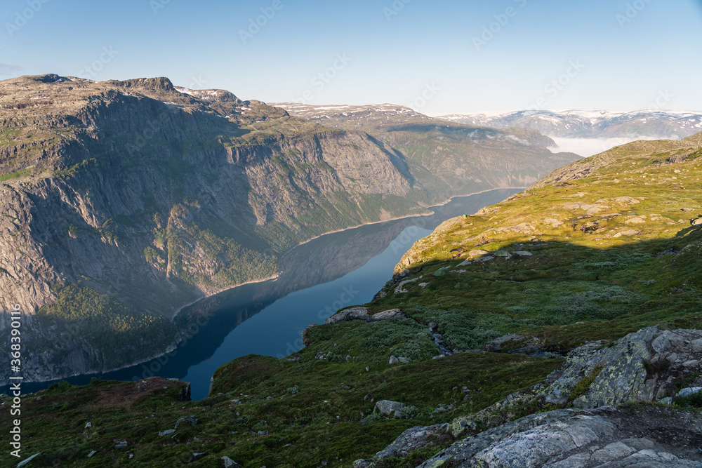 Beautiful landscape of mountains and lake between the way to Trolltunga cliff in Odda, western of Norway in summer season, Norway, Scandinavia