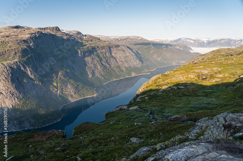 Beautiful landscape of mountains and lake between the way to Trolltunga cliff in Odda, western of Norway in summer season, Norway, Scandinavia