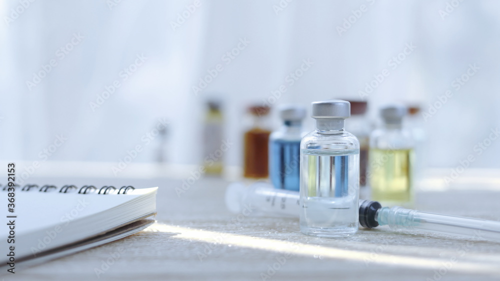 Vaccine bottles placed on the doctor's desk at the hospital. Vaccine bottles placed on the doctor's desk at the hospital.