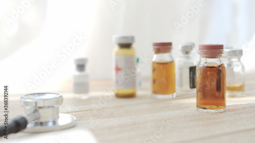 Vaccine bottles placed on the doctor's desk at the hospital.