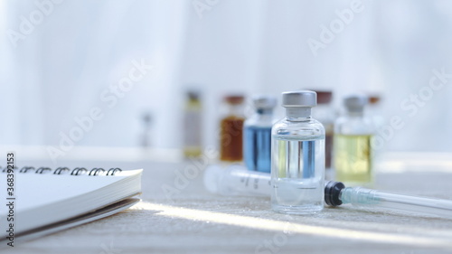 Wallpaper Mural Vaccine bottles placed on the doctor's desk at the hospital. Torontodigital.ca