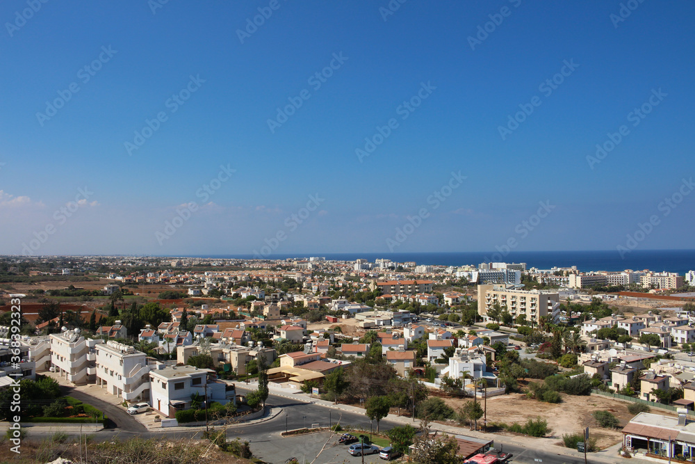 Panorama of Protaras from the observation deck, where the Church of St. Elijah is located against the blue sky. Cyprus.