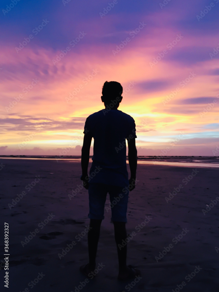 silhouette boy with Colourful sky