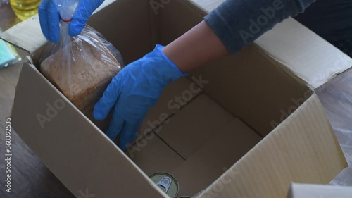 Volunteers with donation boxes for the needy and provide essential supplies to help during the plague Covid-19.