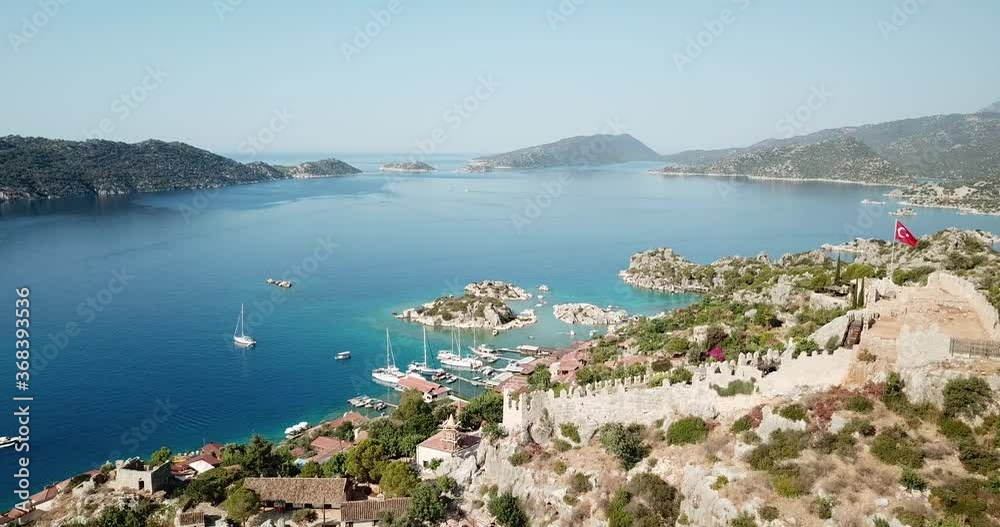 Aerial orbit shot of the old castle on the top of the hill in Kekova, Turkey. Drone moves from left to right Aerial orbit shot of the old castle on the top of the hill in Kekova, Turkey. Drone moves from left to right