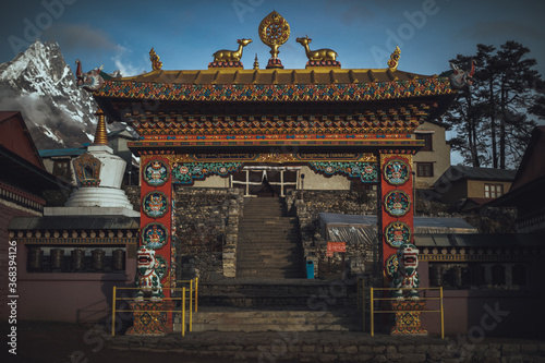 Everest base camp trekking. high mountains in Nepal. Snow summits. blue sky. high altitude landscape. High quality photo. gate to a nepalese monastery. 