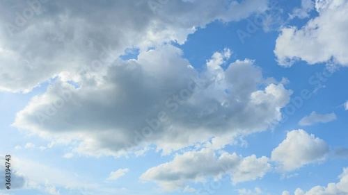 fluffy clouds in blues sky, daytime sky clear light blue space good weather in summer nature background. 4k time-lapse