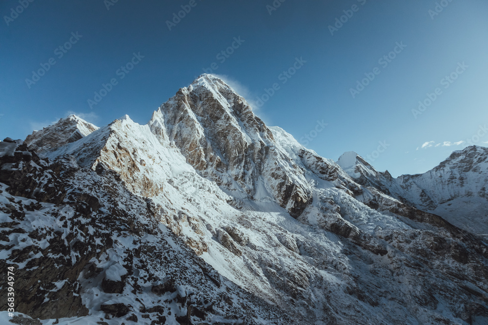 Everest base camp trekking. high mountains in Nepal. Snow summits. view from kalapatar. blue sky. high altitude landscape. High quality photo