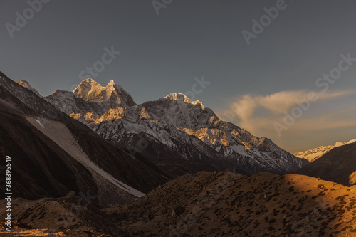 Everest base camp trekking. high mountains in Nepal. Snow summits. blue sky. high altitude landscape. High quality photo Ama dablam photo