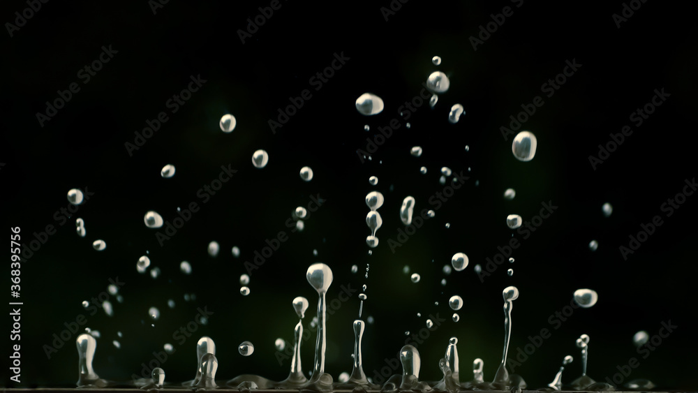 Inverted view of water droplets falling down from a surface. Stock ...