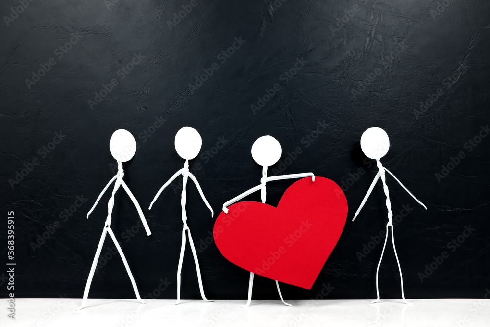 Stick man holding big red heart shape while sharing to other people. Share love and kindness concept.