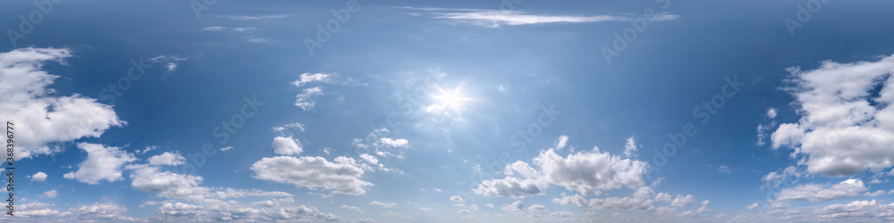 Seamless clear blue sky hdri panorama 360 degrees angle view with zenith and beautiful clouds for use in 3d graphics as sky dome or edit drone shot Seamless clear blue sky hdri panorama 360 degrees angle view with zenith and beautiful clouds for use in 3d graphics as sky dome or edit drone shot