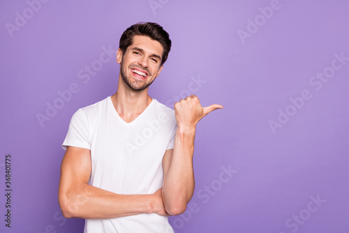 Portrait of his he nice attractive cheerful cheery glad guy freelancer showing copy space advice new novelty isolated over bright vivid shine vibrant lilac violet purple color background
