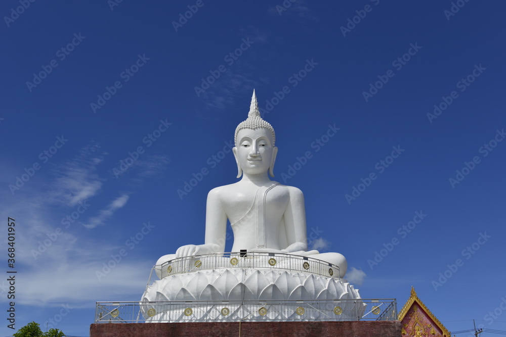 A White big Buddha statue with amazing Blue sky background at Wat HaiSok, NongKhai province Thailand. A White big Buddha statue with amazing Blue sky background at Wat HaiSok, NongKhai province Thailand.
