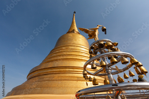 The The Golden Mount at Wat Saket in Bangkok,Thailand, is the famous travel landmark with blue sky background.
