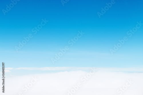 Clouds  on bright blue sky background and copy space © Amphawan