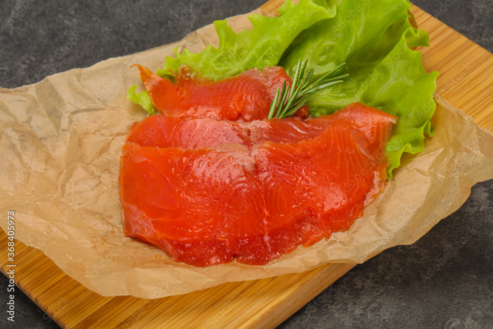 Sliced salmon fillet served rosemary Sliced salmon fillet served rosemary