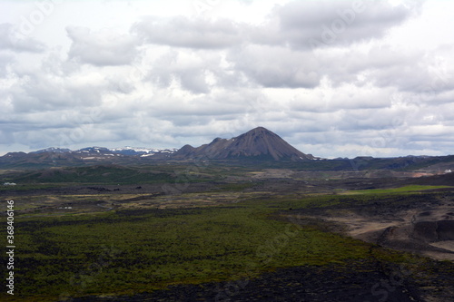 Black cone-shaped crater of the extinct volcano Nverfjall in Iceland