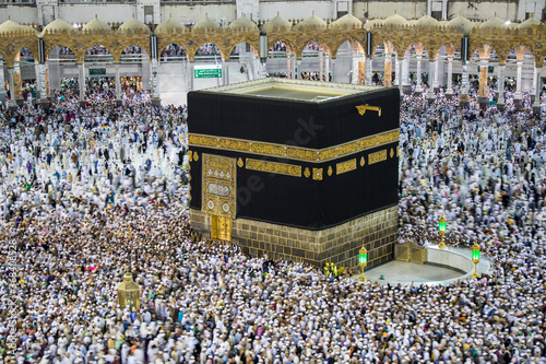Holy Kaaba. Crowd of muslims walking around Kaaba for Tawaf during Hajj. photo