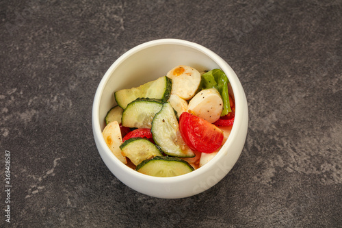 Salad with vegetables and mozzarlla photo