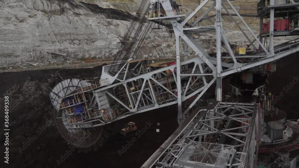 Aerial view of the biggest in Europe Bucket-wheel excavator mining for coal in Poland. Open pit mining. Aerial view of the biggest in Europe Bucket-wheel excavator mining for coal in Poland. Open pit mining.