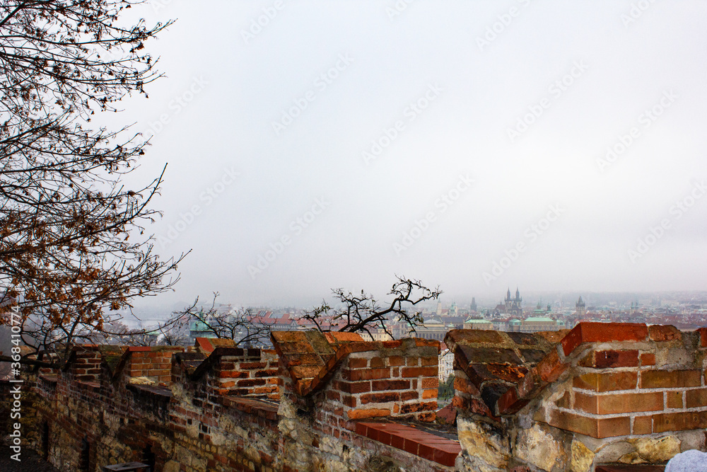 Red roofs of Prague on a foggy day. Prague city view from above. Panorama of Prague. Prague on a foggy day. Fog over the city.