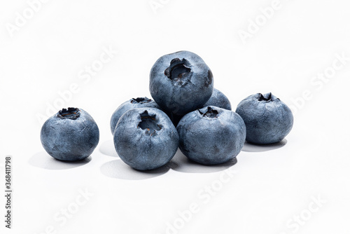  Ripe sweet blueberries on a white background.