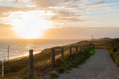 Photograph at the beach and dunes moments before the sun sets in the southwest of the Netherlands. 