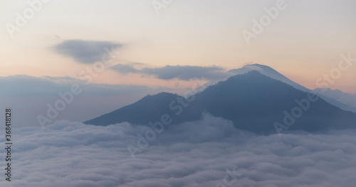 Scenic view of clouds and mist at sunrise