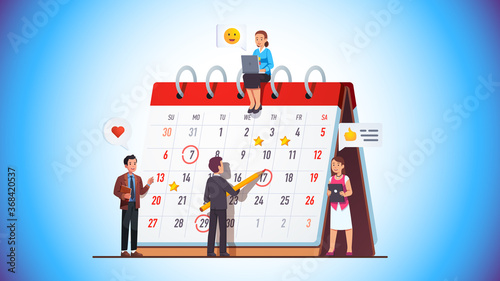 Business team drawing day mark on planner meeting