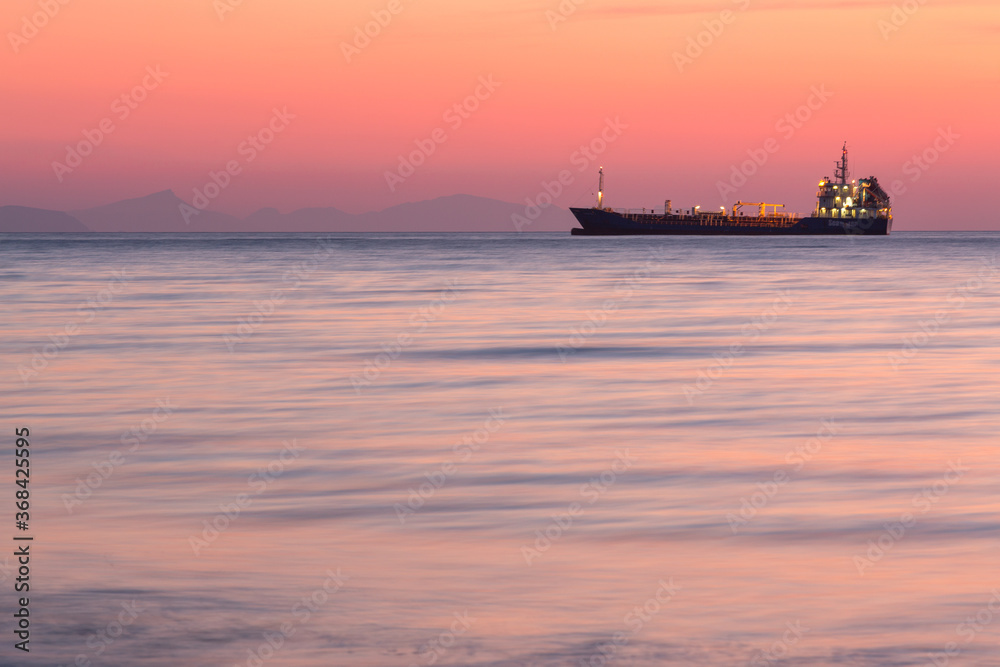 sunset with yachts on santorini island