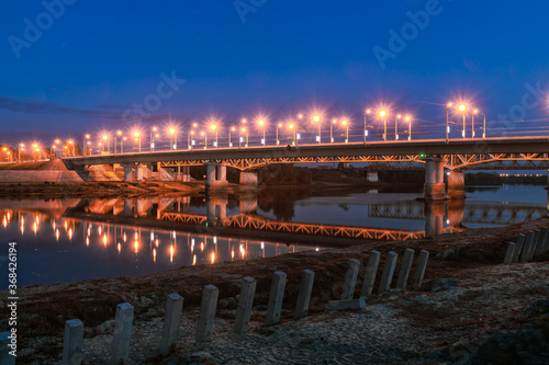 bridge with illumination across the river in summer evening © makam1969