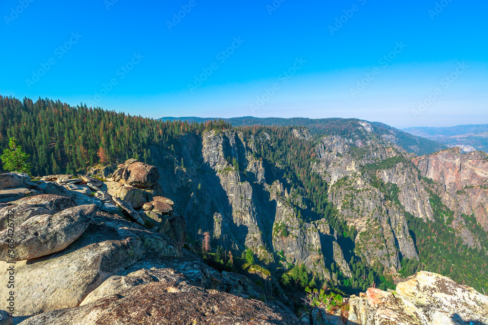 Taft Point lookout in Yosemite National Park, California, United States. The view from Taft Point: Yosemite Valley, El Capitan and Yosemite Falls. Summer travel in America.