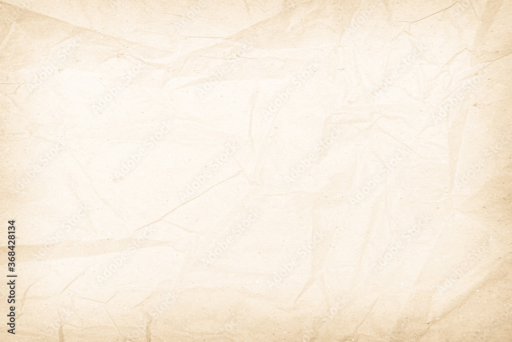 Fototapeta premium Brown recycled paper crumpled texture background. Cream Old vintage page or grunge vignette parchment old blank newspaper. Pattern empty rough cardboard creased grunge surface backdrop with space.