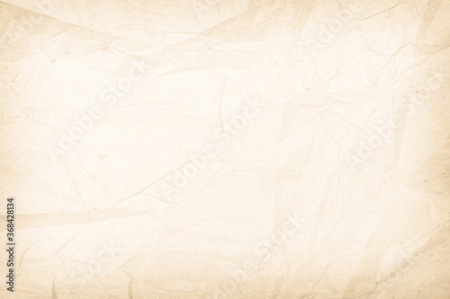 Brown recycled paper crumpled texture background. Cream Old vintage page or grunge vignette parchment old blank newspaper. Pattern empty rough cardboard creased grunge surface backdrop with space.