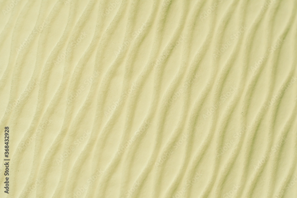 Soft blurred pale yellow rib waves fabric texture background. Soft blurred pale yellow rib waves fabric texture background.