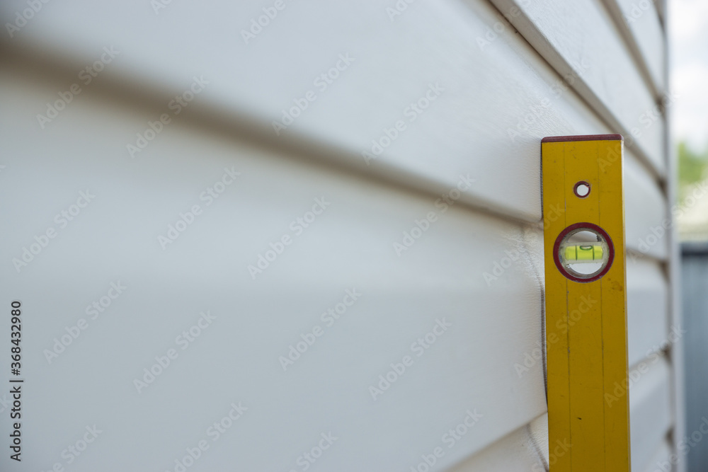 Fotografia do Stock: Suburban and cottage construction. A yellow level ...