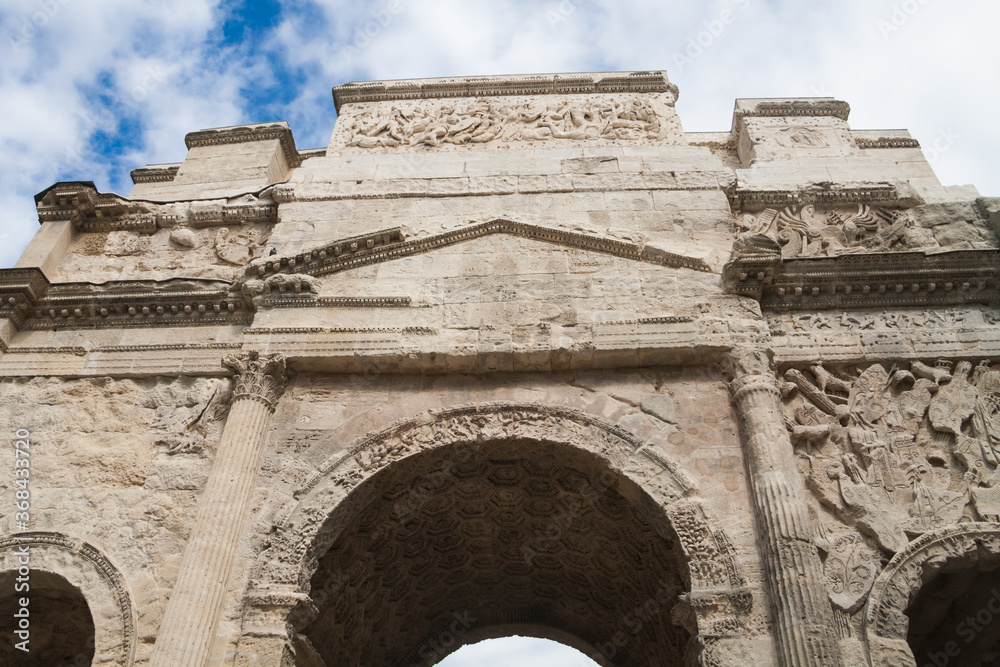 Closeup of the facade details of the Triumphal Arch (Arc de Triomphe) in Orange, France